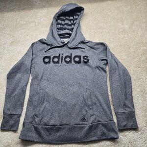 Gray Adidas Ultimate Hoodie with black striped hood lining and a black logo